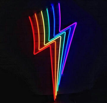 a picture of a rainbow neon lightning bold on a black background